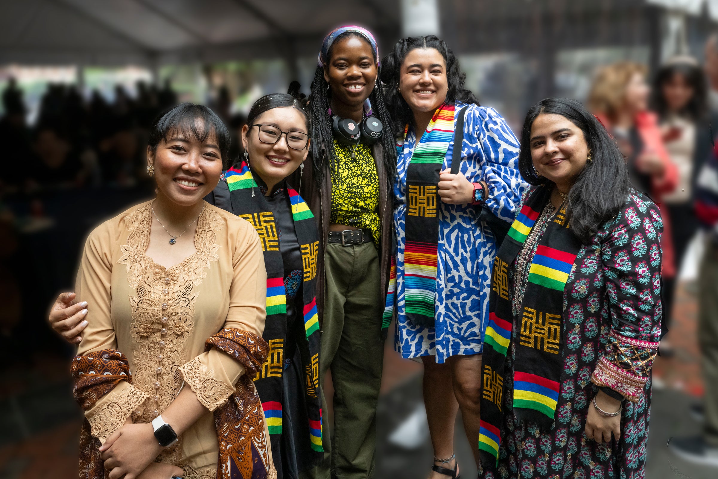 Five female students of varying ethnic backgrounds pose as a group.